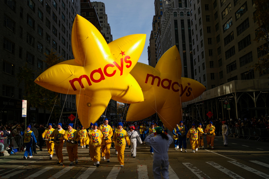 Balloon handlers guide the Macy's balloons down Sixth Avenue during the Macy's Thanksgiving Day Parade, Thursday, Nov. 27, 2025, in New York. (AP Photo/Eduardo Munoz Alvarez)