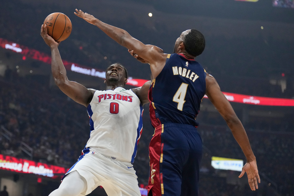 Detroit Pistons' Jalen Duren (0) shoots as Cleveland Cavaliers' Evan Mobley (4) defends in the first half of Game 6 of a second-round NBA basketball playoffs series Friday, May 15, 2026, in Cleveland. (AP Photo/Sue Ogrocki)