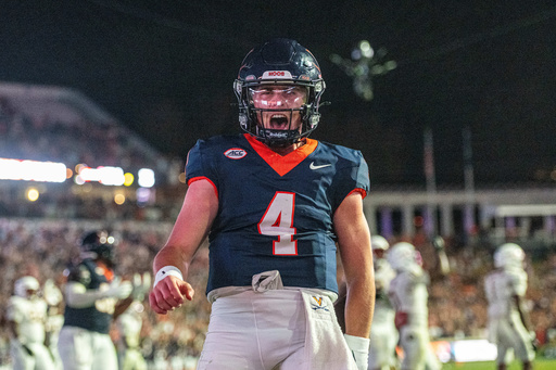 Virginia quarterback Chandler Morris (4) celebrates after a touchdown during the second half of an NCAA college football game, Friday, Sept. 26 2025, in Charlottesville, Va. (AP Photo/Robert Simmons) Virginia quarterback Chandler Morris (4) celebrates after a touchdown during the second half of an NCAA college football game, Friday, Sept. 26 2025, in Charlottesville, Va. (AP Photo/Robert Simmons)