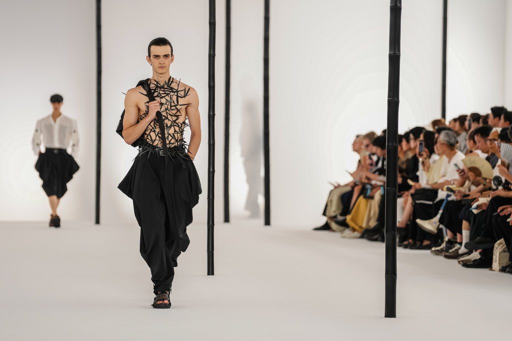 A model wears a creation as part of the Issey Miyake Homme Spring Summer 2027 collection presented in Paris, France, Thursday, June 25, 2026. (AP Photo/Aurelien Morissard)