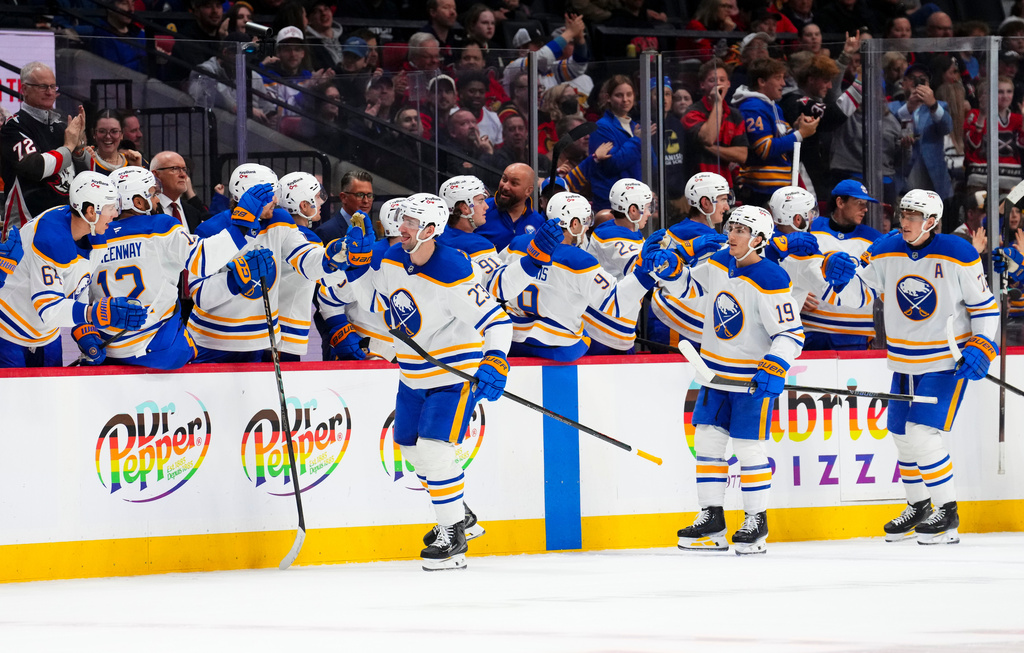 Buffalo Sabres' Mattias Samuelsson (23), front left, celebrates his goal with the bench against the Ottawa Senators during the second period of an NHL hockey game in Ottawa on Thursday, April 2, 2026. (Sean Kilpatrick/The Canadian Press via AP)