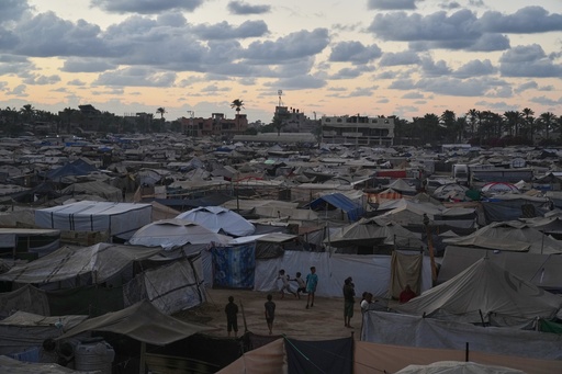 Dusk falls as children play at a temporary tent camp for displaced Palestinians in Deir al-Balah, in the central Gaza Strip, Monday, Oct. 6, 2025. (AP Photo/Abdel Kareem Hana) Dusk falls as children play at a temporary tent camp for displaced Palestinians in Deir al-Balah, in the central Gaza Strip, Monday, Oct. 6, 2025. (AP Photo/Abdel Kareem Hana)