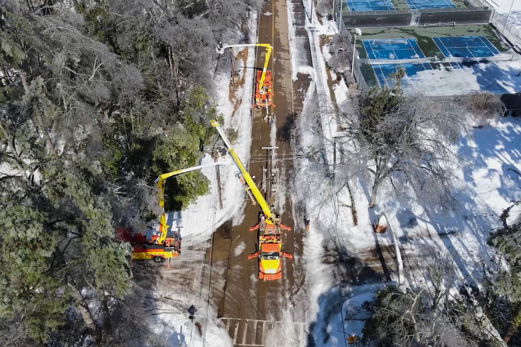 This image taken from a video released by the city of Oxford, Miss., shows crews working on power lines Tuesday, Jan. 27, 2026. (City of Oxford Mississippi via AP)