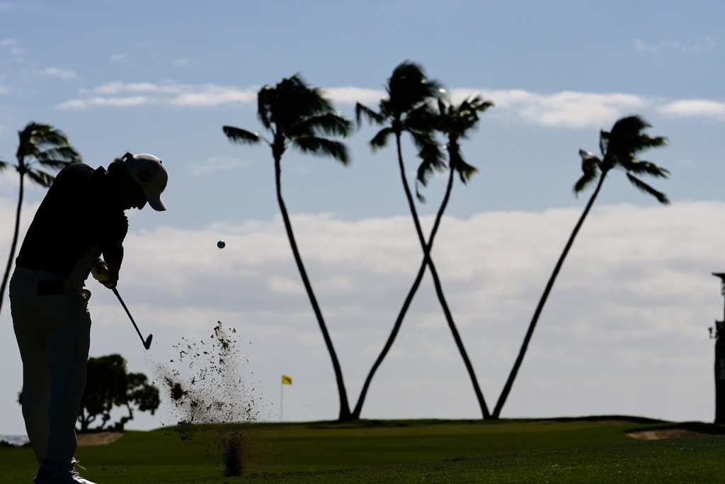 Kota Kaneko, of Japan, hits on the 16th hole during the third round of the Sony Open golf event at the Waialae Country Club in Honolulu, Saturday, Jan. 17, 2026. (AP Photo/Matt York)