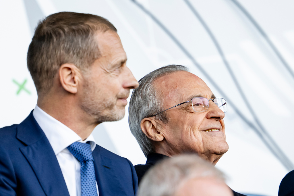 UEFA President Aleksander Ceferin, left, and Real Madrid's president Florentino Perez, right, watch the Youth League final soccer match between Club Brugge and Real Madrid in Lausanne, Switzerland, Monday, April 20, 2026. (Jean-Christophe Bott/Keystone via AP)
