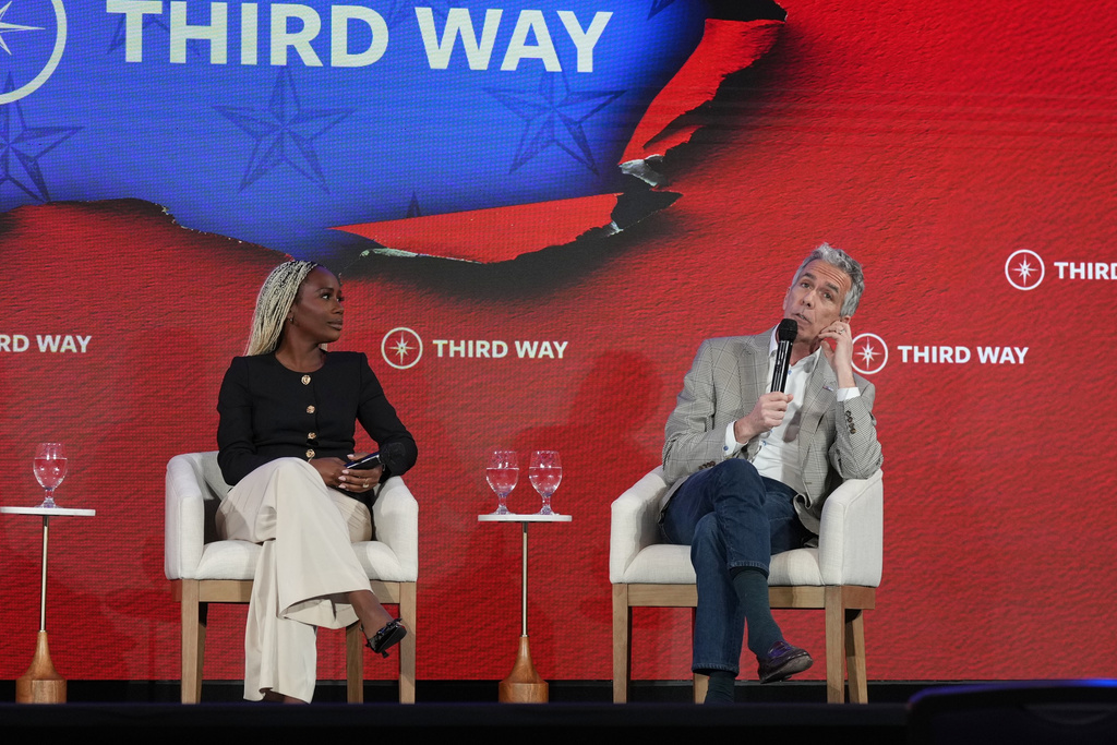 Former Rep. Joe Walsh, R-Ill., right, speaks about becoming a Democrat as panelist Yemisi Egbewole listnes during Third Way's "Winning the Middle" conference on Monday, March 2, 2026, in Charleston, S.C. (AP Photo/Meg Kinnard)