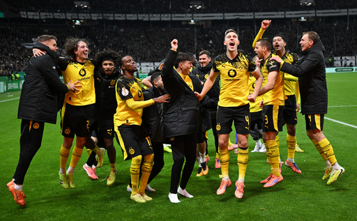 Dortmund's players celebrate after winning a German soccer cup second round match between Eintracht Frankfurt and Borussia Dortmund in Frankfurt, Germany, Tuesday, Oct. 28, 2025. (Arne Dedert/dpa via AP) Dortmund's players celebrate after winning a German soccer cup second round match between Eintracht Frankfurt and Borussia Dortmund in Frankfurt, Germany, Tuesday, Oct. 28, 2025. (Arne Dedert/dpa via AP)