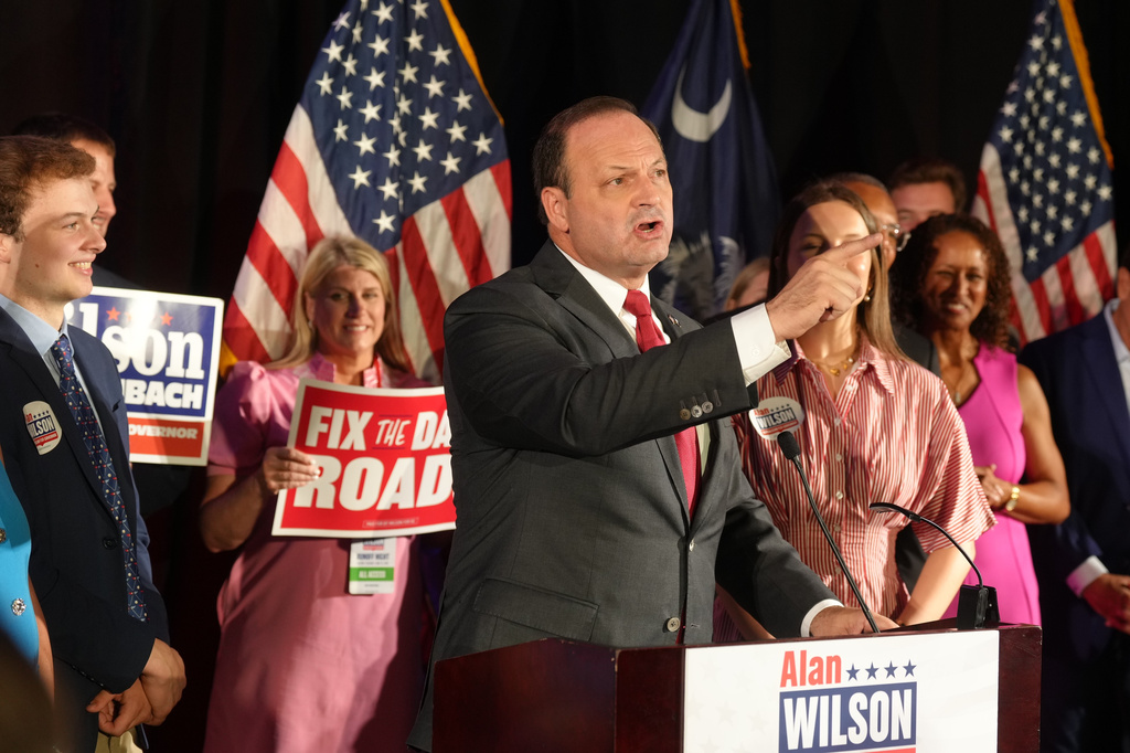 South Carolina Attorney General Alan Wilson speaks to supporters, accompanied by his wife Jennifer and their children, Michael, left, and Anna Grace, during his gubernatorial runoff victory party in Columbia, S.C., Tuesday, June 23, 2026. (AP Photo/Meg Kinnard)
