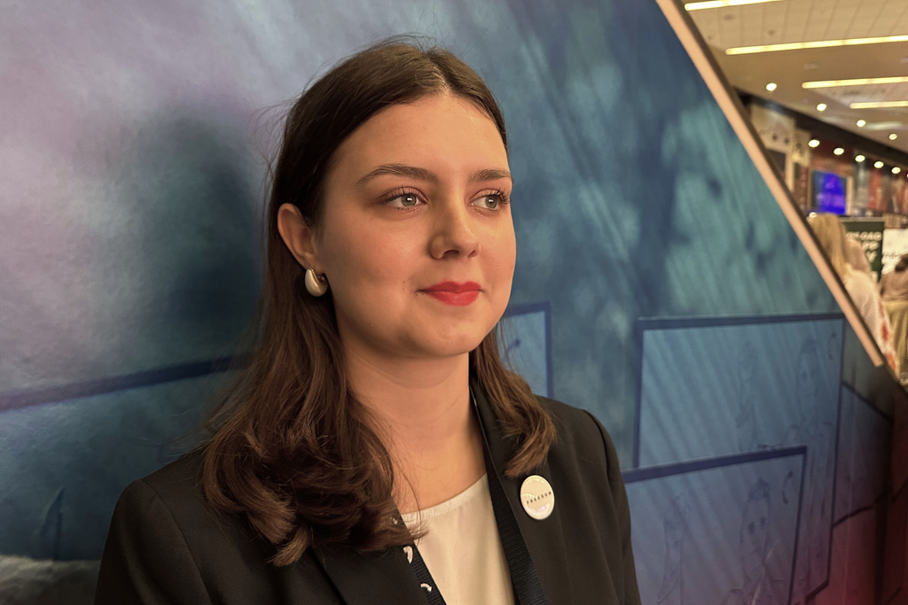 Camdyn Glover, who says she's found a political and cultural home for herself in Turning Point USA, attends the organization's annual conference in Phoenix on Friday, Dec. 19, 2025. (AP Photo/Sejal Govindarao)