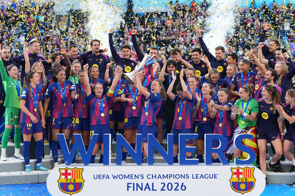 FILE - Barcelona's Irene Paredes lifts the trophy after winning the Women's Champions League final soccer match between FC Barcelona and OL Lyonnes, in Oslo, on May 23, 2026. (AP Photo/Kirsty Wigglesworth)