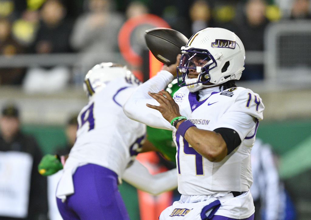 James Madison quarterback Alonza Barnett III (14) throws a pass against Oregon during the second half in the first round of the NCAA College Football Playoff, Saturday, Dec. 20, 2025, in Eugene, Ore. (AP Photo/Mark Ylen)