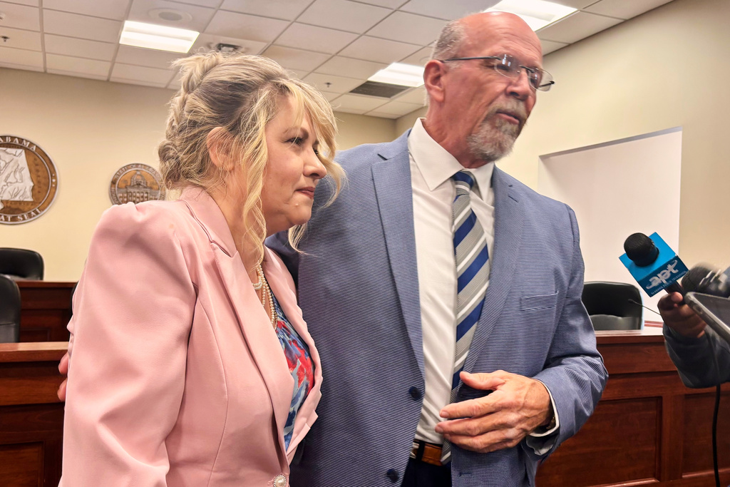 Alabama Medical Cannabis Commission Chairman Rex Vaughn, right, and Patients Advocate Amanda Taylor, left, answer questions after a meeting at the Alabama Statehouse in Montgomery, Ala., Thursday, Dec. 11, 2025. (AP Photo/Kim Chandler)