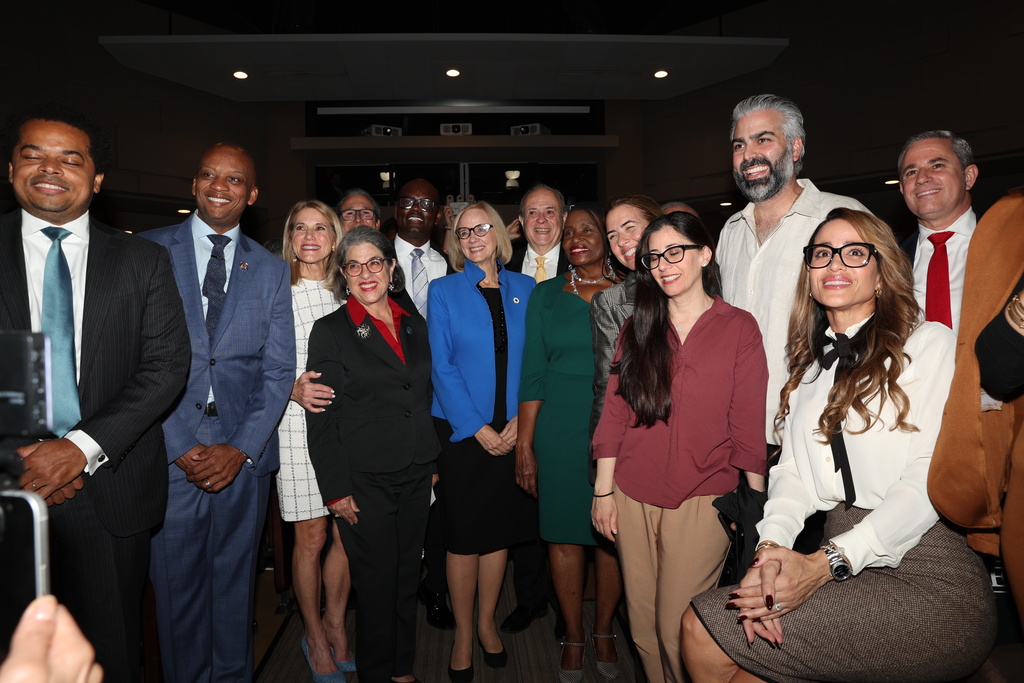 Miami Mayor Eileen Higgins poses for a photo with attendees during her installation ceremony, Thursday, Dec. 18, 2025, in Miami. (AP Photo/Alexandar Rodriguez)
