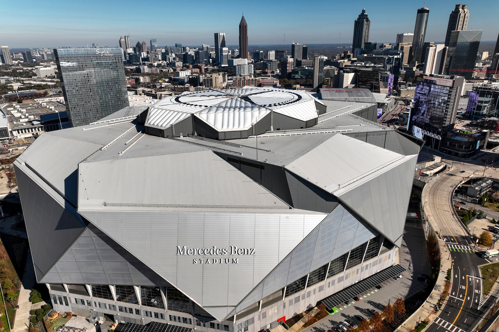 FILE - The Mercedes Benz stadium and Atlanta skyline is seen, Friday, Dec. 12, 2025, in Atlanta. (AP Photo/Mike Stewart,File)