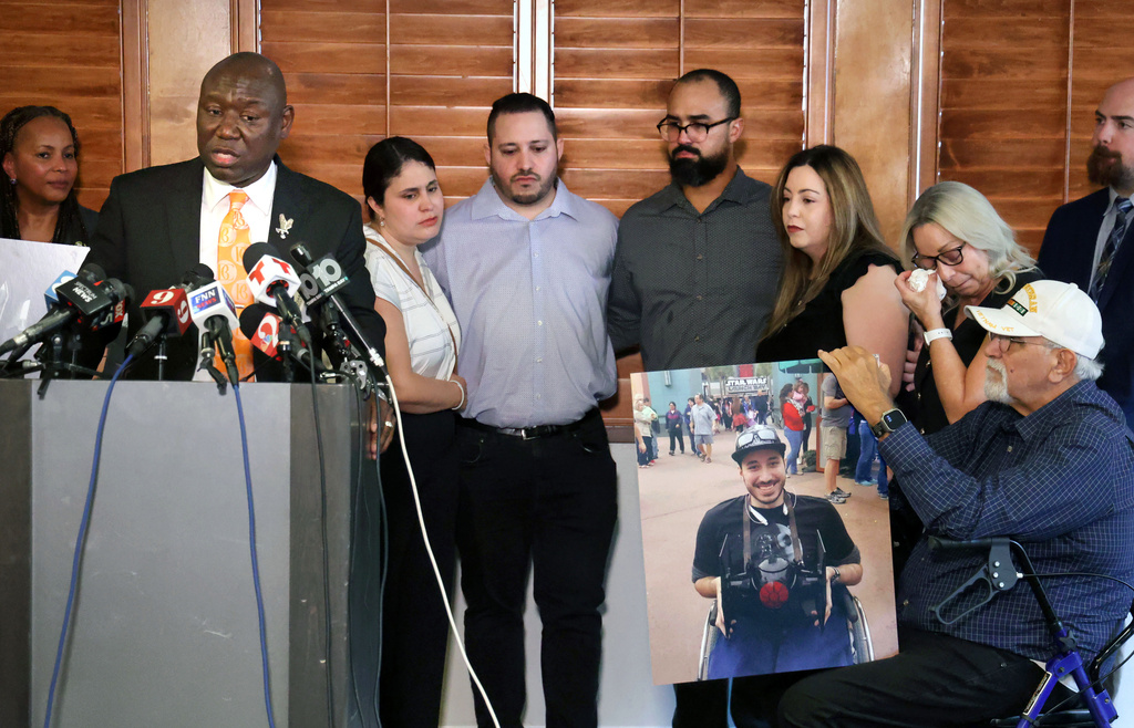 Attorney Benjamin Crump answers questions with family members of Kevin Zavala —including Zavala's mother Ana Zavala and father Carlos Rodriguez Ortiz, right—during a press conference in downtown Orlando, Fla., Wednesday, Sept. 24, 2025. (Joe Burbank/Orlando Sentinel via AP)