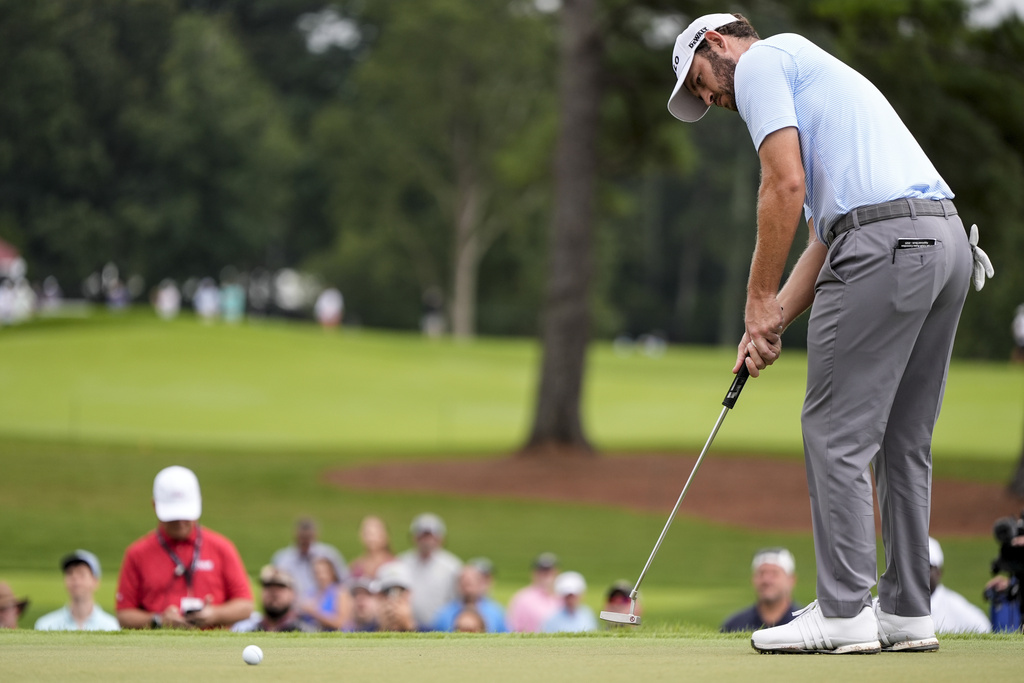 Patrick Cantlay putts on the third green during the second round of the Tour Championship golf tournament, Friday, Aug. 22, 2025, in Atlanta. (AP Photo/Mike Stewart)