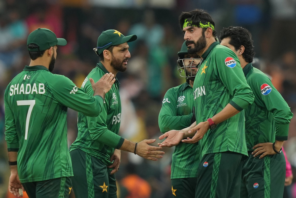 Pakistan's Usman Tariq, right , celebrates with captain Salman Ali Agha, centre, the wicket of Namibia's Ruben Trumpelmann during the T20 World Cup cricket match between Namibia and Pakistan in Colombo, Sri Lanka, Wednesday, Feb. 18, 2026. (AP Photo/Eranga Jayawardena)
