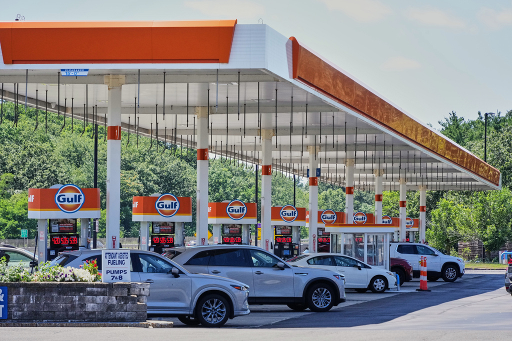 FILE - Cars line up at the pumps of a Gulf Oil station on the Massachusetts Turnpike near Boston, Sunday, July 19, 2026. (AP Photo/Gene J. Puskar, File)