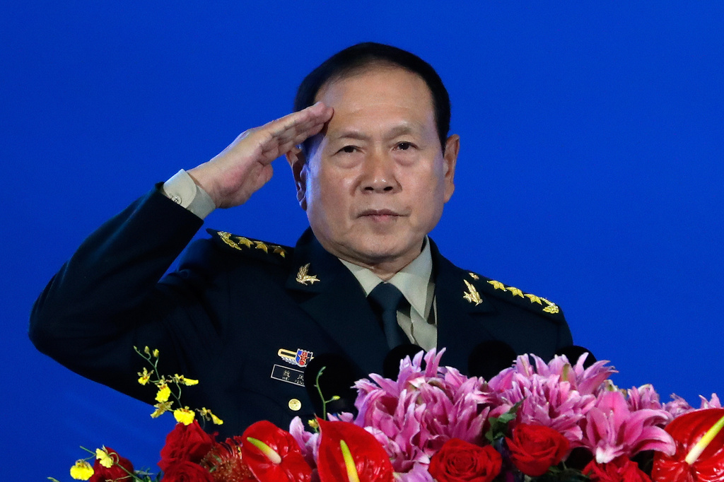 FILE - Chinese Defense Minister Wei Fenghe salutes after delivering his opening speech for the Xiangshan Forum, a gathering of the region's security officials, in Beijing, Monday, Oct. 21, 2019. (AP Photo/Andy Wong, File)