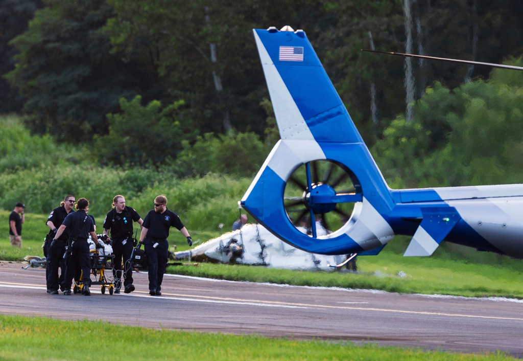 Authorities investigate a crash between a Pennsylvania State Police helicopter and a small plane at the Carlisle airport in Carlisle, Pa. Wednesday, Aug. 19, 2026. (Sean Simmers/The Patriot-News via AP)