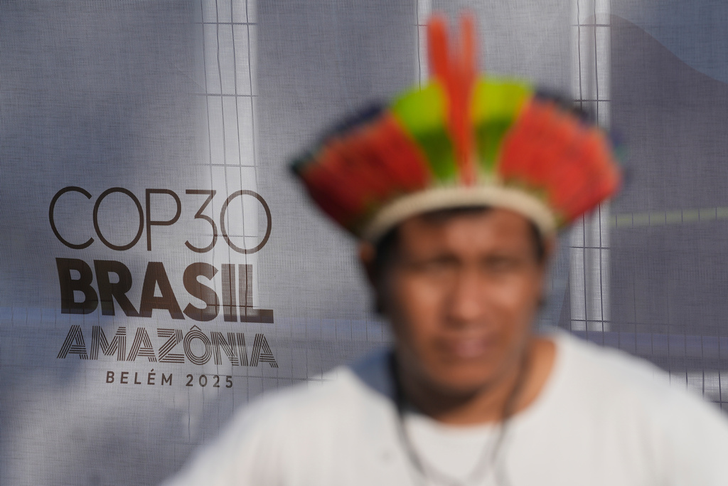 An Indigenous man takes part in a demonstration in defense of the Amazon during the COP30 U.N. Climate Summit, in Belem, Para state, Brazil, Thursday, Nov. 6, 2025. (AP Photo/Eraldo Peres)
