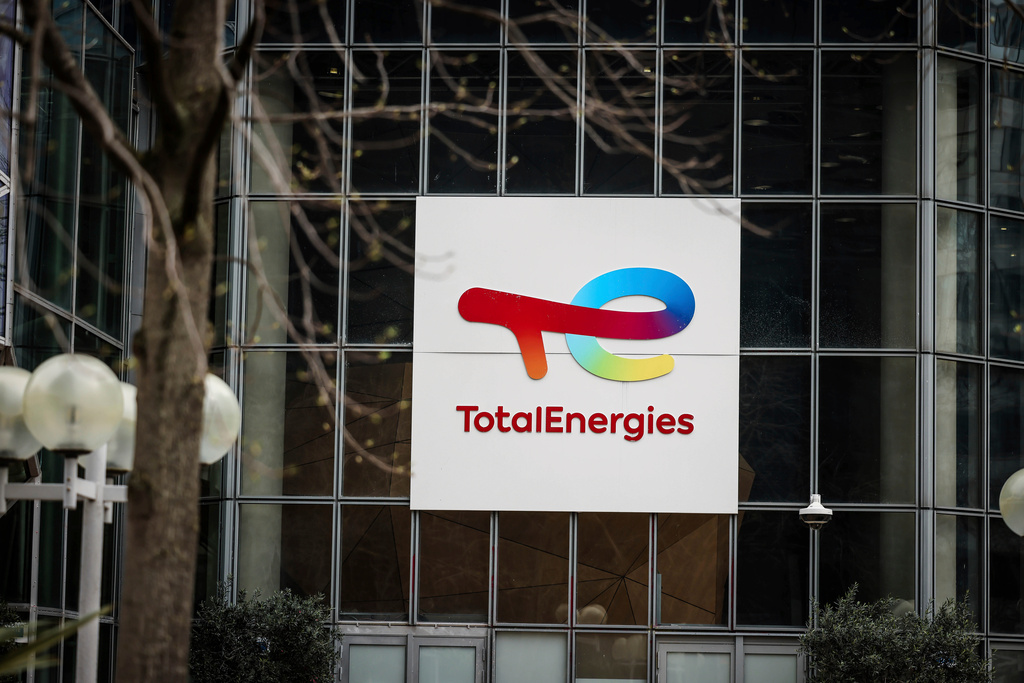 FILE - A sign for French company TotalEnergies is displayed March 21, 2025, in La Defense business district outside Paris. (AP Photo/Thomas Padilla, File)
