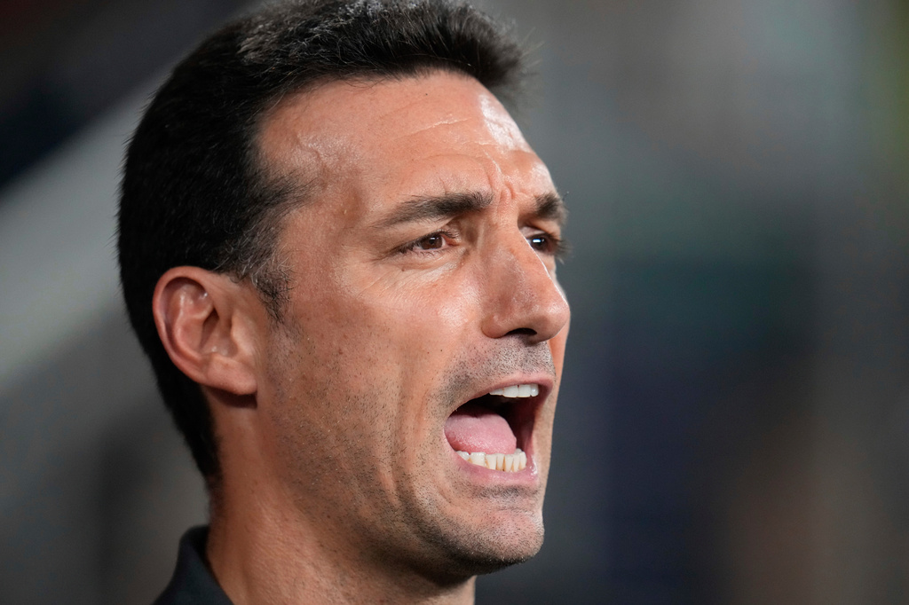 FILE - Argentina's coach Lionel Scaloni sings his national anthem prior to the Copa America final soccer match against Colombia in Miami Gardens, Fla., July 14, 2024. (AP Photo/Julio Cortez, File)
