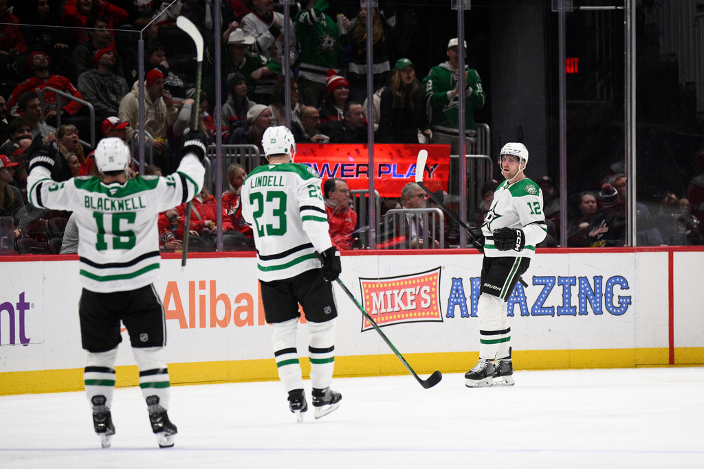 Dallas Stars center Radek Faksa (12) celebrates his goal with center Colin Blackwell (15) and defenseman Esa Lindell (23) during the first period of an NHL hockey game against the Washington Capitals, Wednesday, Jan. 7, 2026, in Washington. (AP Photo/Nick Wass)