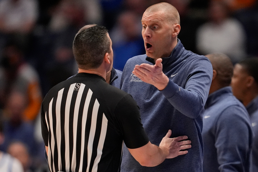 Kentucky head coach Mark Pope speaks to an official during the first half of an NCAA college basketball game in the quarterfinal round of the Southeastern Conference tournament against Florida, Friday, March 13, 2026, in Nashville, Tenn. (AP Photo/George Walker IV)