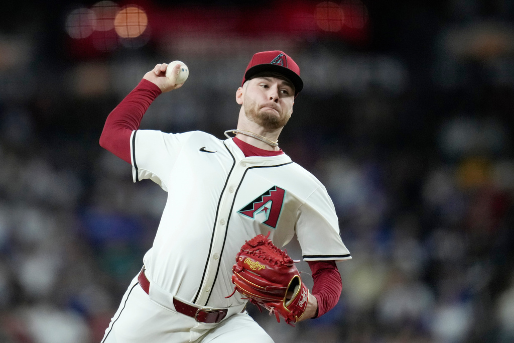 Arizona Diamondbacks starting pitcher Ryne Nelson throws against the Los Angeles Dodgers during the first inning of a baseball game Wednesday, Sept. 24, 2025, in Phoenix. (AP Photo/Ross D. Franklin)