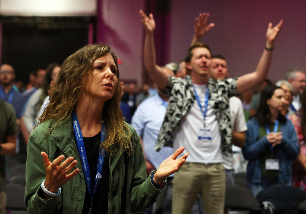 FILE - Messengers attending the Southern Baptist Convention participate in worship during the 2025 SBC Annual Meeting, June 10, 2025, in Dallas. (AP Photo/Richard W. Rodriguez, File)