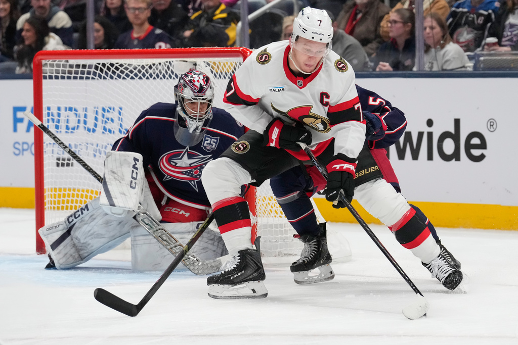 Ottawa Senators left wing Brady Tkachuk (7) skates in front of Columbus Blue Jackets goaltender Jet Greaves (73) int he second period of an NHL hockey game Thursday, Dec. 11, 2025, in Columbus, Ohio. (AP Photo/Sue Ogrocki)