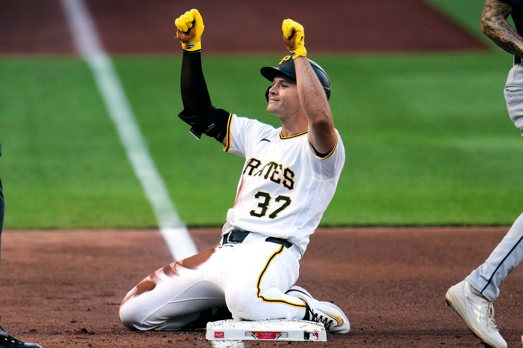 Pittsburgh Pirates' Tyler Callihan (37) celebrates after driving in a run with a triple off Seattle Mariners pitcher Bryan Woo during the fourth inning of a baseball game in Pittsburgh, Wednesday, June 24, 2026. (AP Photo/Gene J. Puskar)