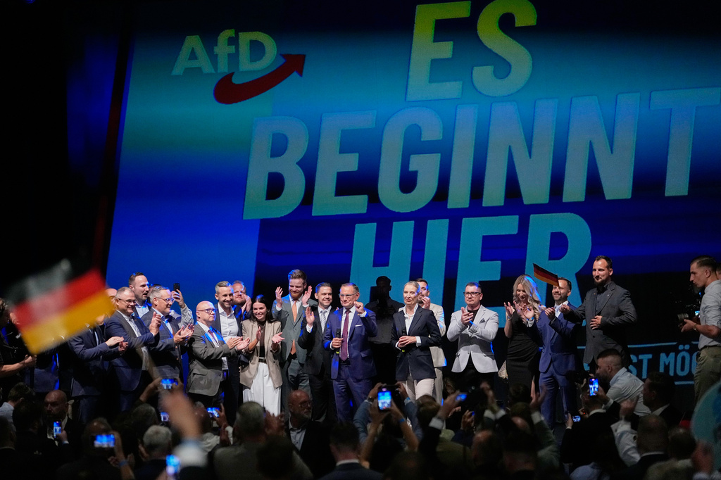 Top candidate Ulrich Siegmund and party leaders Tino Chrupalla and Alice Weidel, speak to party members in front of a reading "it starts here" at an election party of the "Alternative for Germany" (AfD) after the Saxony-Anhalt state elections in Magdeburg, eastern Germany, Sunday, Sept. 6, 2026. (AP Photo/Matthias Schrader)