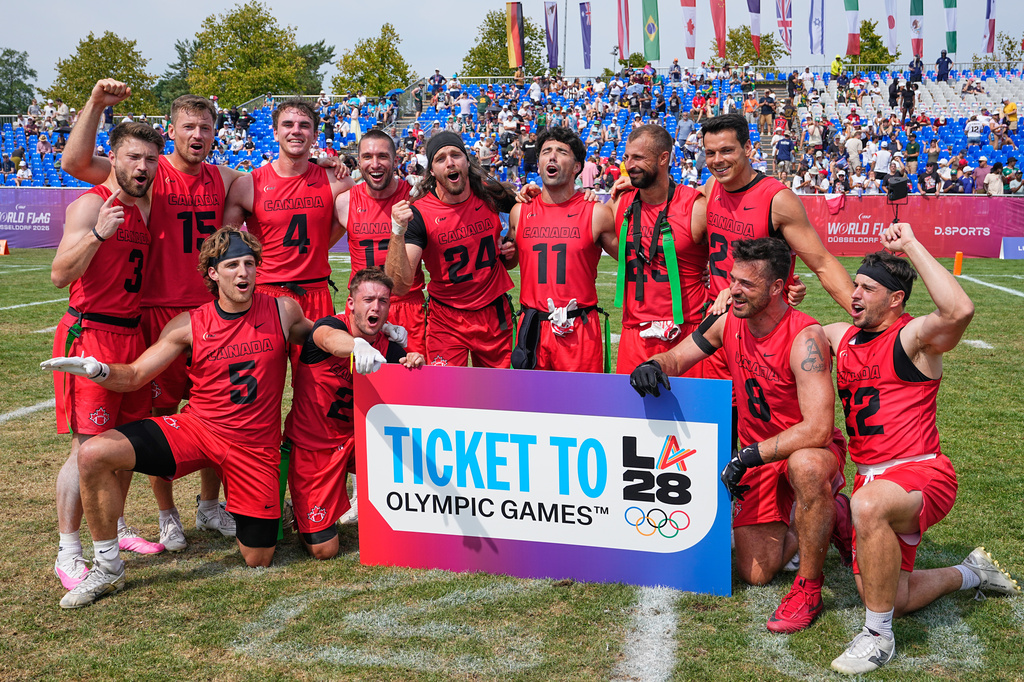 Team Canada celebrates the Olympic qualification for LA 26 after winning the Flag Football World Championship men's bronze medal game between Canada and Mexico in Duesseldorf, Germany, Sunday, Aug. 16, 2026. (AP Photo/Martin Meissner)