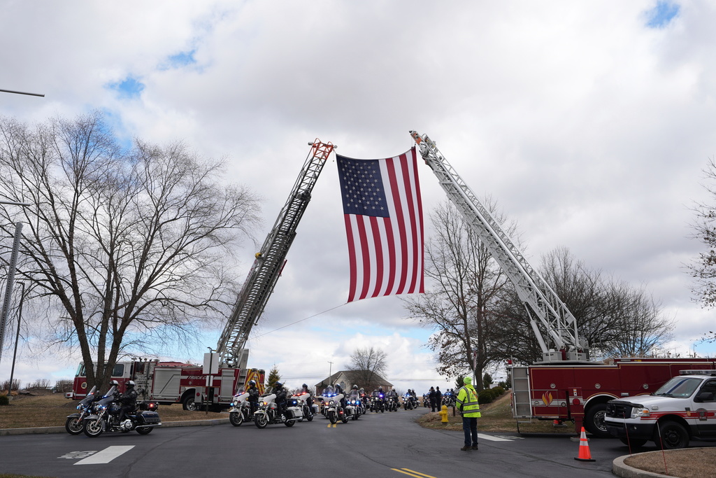 FILE - The police procession arrives for the funeral of West York Borough Police Officer Andrew Duarte at Living Word Community Church, in Red Lion, Pa., Feb. 28, 2025. (AP Photo/Matt Rourke, File)