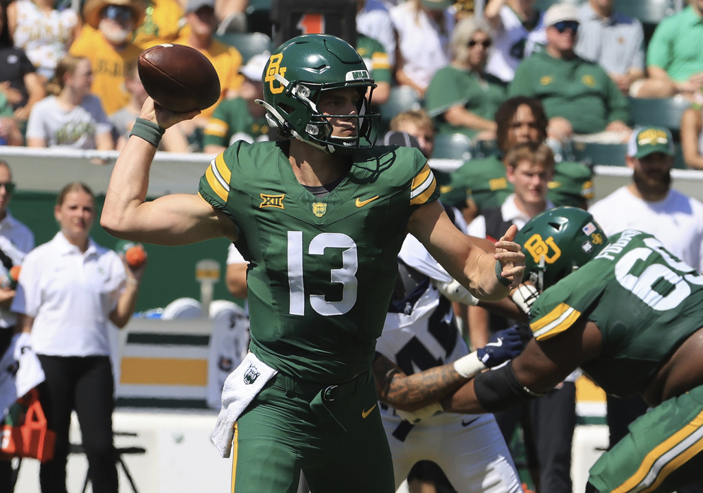 Baylor's quarterback Sawyer Robertson throws downfield against Samford in the first half of an NCAA college football game, Saturday, Sept. 13, 2025, in Waco, Texas. (Jerry Larson/Waco Tribune-Herald via AP)