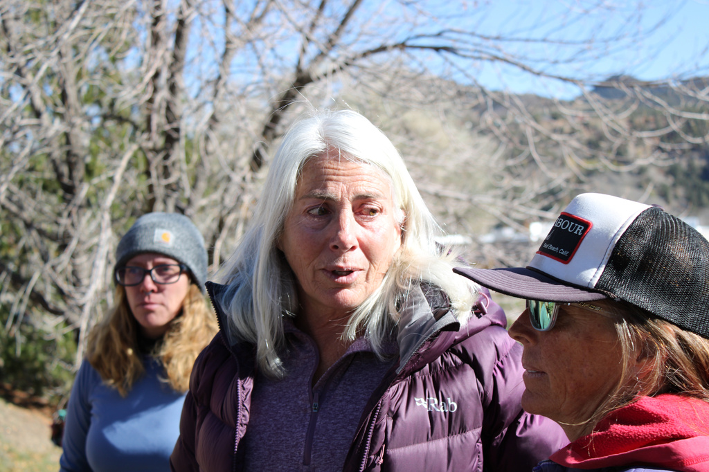 Franci Stagi, center, stands on Oct. 28, 2025, in in Durango, Colo., after she was allegedly assaulted by an immigration officer outside the U.S. Immigration and Customs Enforcement field office. (Christian Burney/Durango Herald via AP)