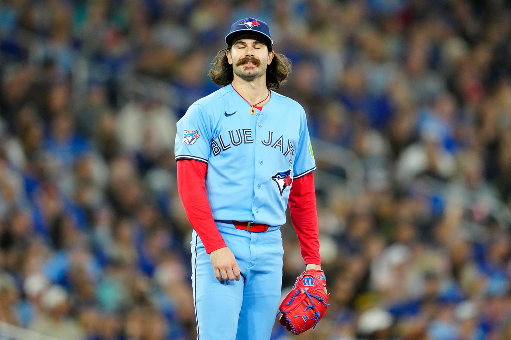 Toronto Blue Jays pitcher Dylan Cease reacts after giving up the second solo home run of the game during the second inning of an baseball game against the Pittsburgh Pirates in Toronto on Sunday, May 24, 2026. (Frank Gunn/The Canadian Press via AP)