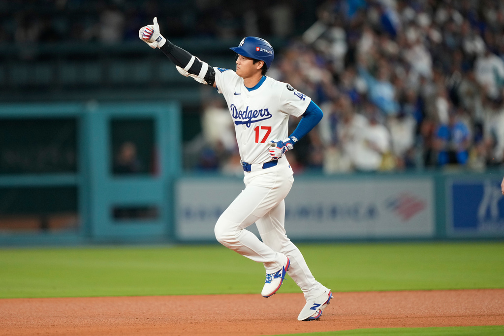 Los Angeles Dodgers' Shohei Ohtani celebrates after his two-run home run during the sixth inning in Game 1 of the National League Wild Card baseball playoff series against the Cincinnati Reds, Tuesday, Sept. 30, 2025, in Los Angeles. (AP Photo/Mark J. Terrill)