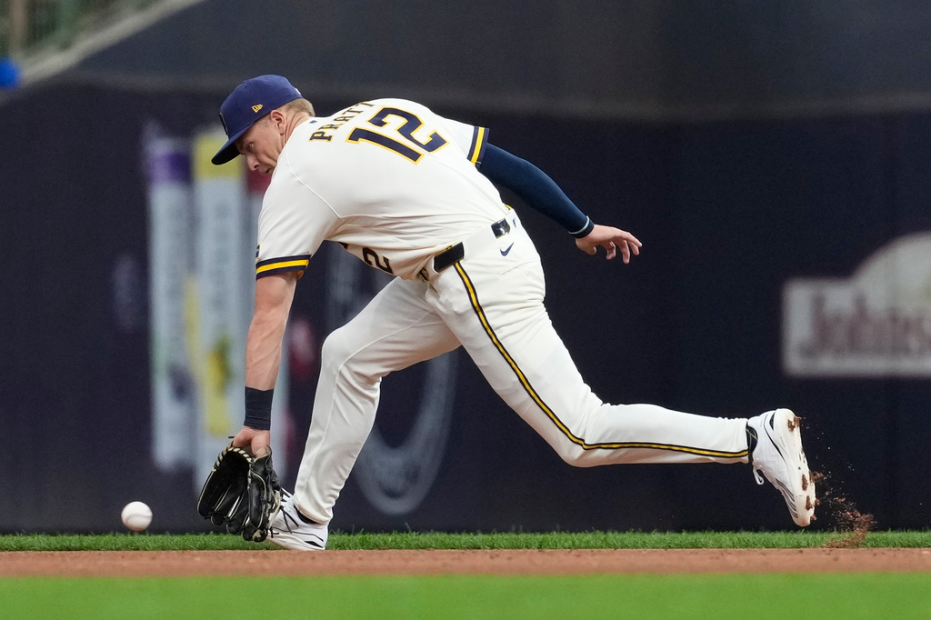 Milwaukee Brewers' Cooper Pratt fields a ground ball during the fourth inning of a baseball game against the Cleveland Guardians, Tuesday, June 16, 2026, in Milwaukee. (AP Photo/Aaron Gash)