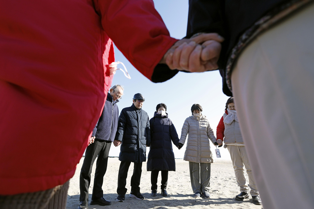 Prayers join their hands in Sendai, Miyagi prefecgture, northern Japan Wednesday, March 11, 2026, as the country marked the 15th anniversary of the massive earquake, tsunami and nuclear disaster. (Natsumi Yasumoto/Kyodo News via AP)