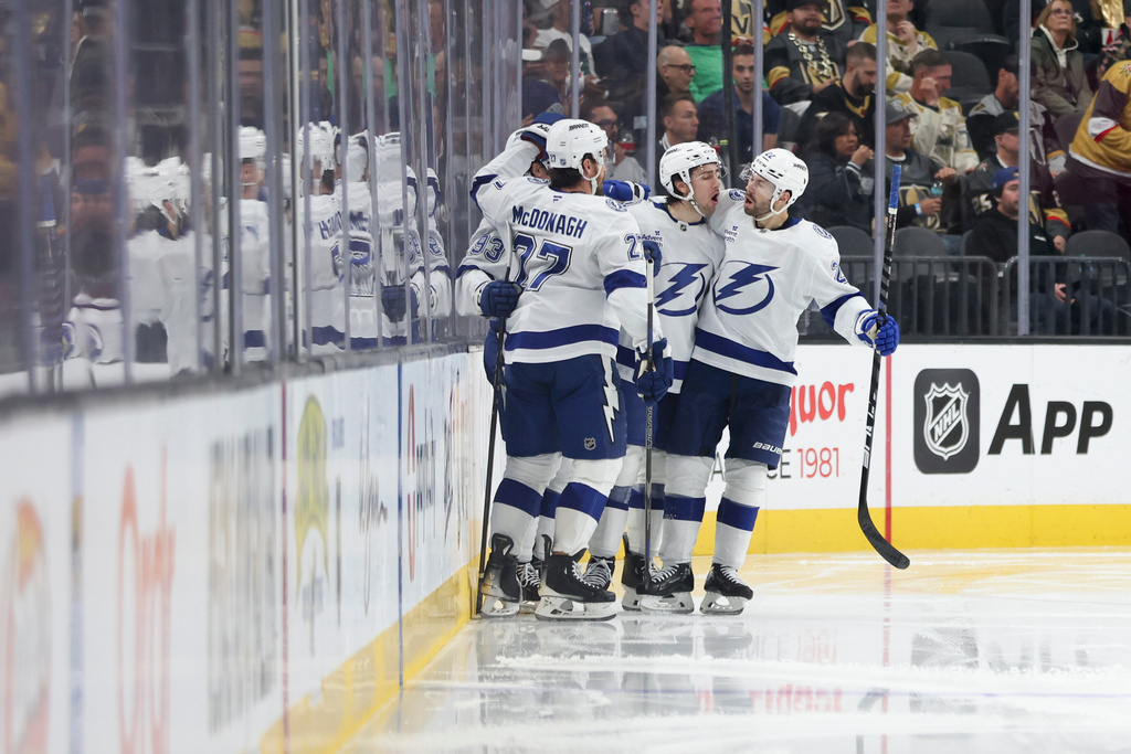 Tampa Bay Lightning center Gage Goncalves (93) and right wing Oliver Bjorkstrand (22) celebrate after Goncalves's goal against the Vegas Golden Knights during the second period of an NHL hockey game Thursday, Nov. 6, 2025, in Las Vegas. (AP Photo/Ian Maule)