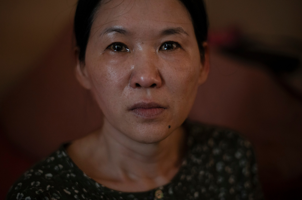 FILE - Yooree Kim, who was sent to a French family in 1984 without her biological parents’ consent, based on documents that falsely described her as an abandoned orphan, sits for a portrait as tears well up in her eyes in her apartment in Seoul, South Korea, Sunday, May 19, 2024. (AP Photo/Jae C. Hong, File)