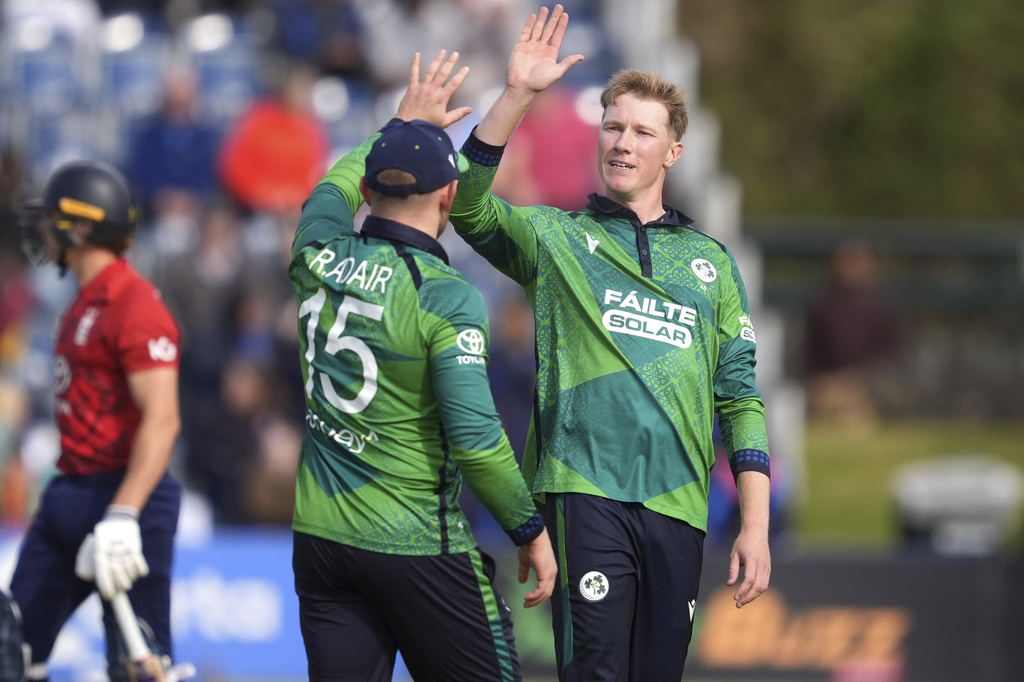 Ireland's Ross Adair (left) celerbates the wicket of England's Jacob Bethell with team-mate Harry Tector during the First Men's International Twenty20 match between Ireland and England, at Malahide Cricket Club in Dublin, Ireland, Wednesday Sept. 17, 2025. (Brian Lawless/PA via AP)
