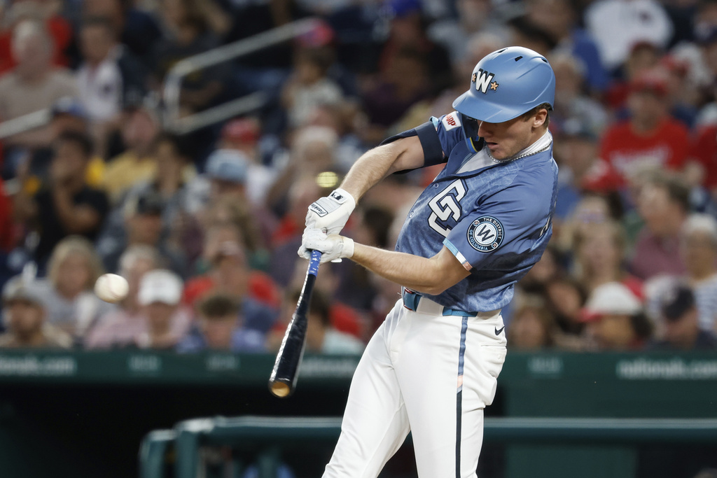 Washington Nationals' Robert Hassell III hits a single against Pittsburgh Pirates pitcher Mitch Keller during the third inning of a baseball game, Friday, Sept. 12, 2025, in Washington. (AP Photo/Terrance Williams)