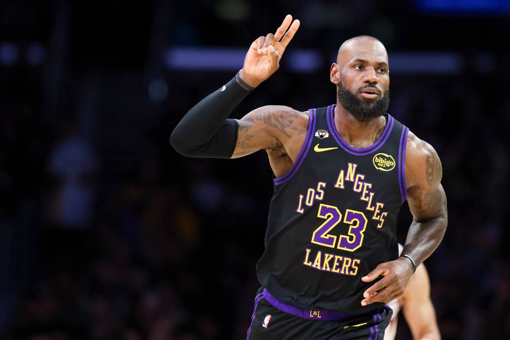 Los Angeles Lakers forward LeBron James gestures after making a basket against the Phoenix Suns during the first half of an NBA basketball game, Friday, April 10, 2026, in Los Angeles. (AP Photo/Jessie Alcheh)