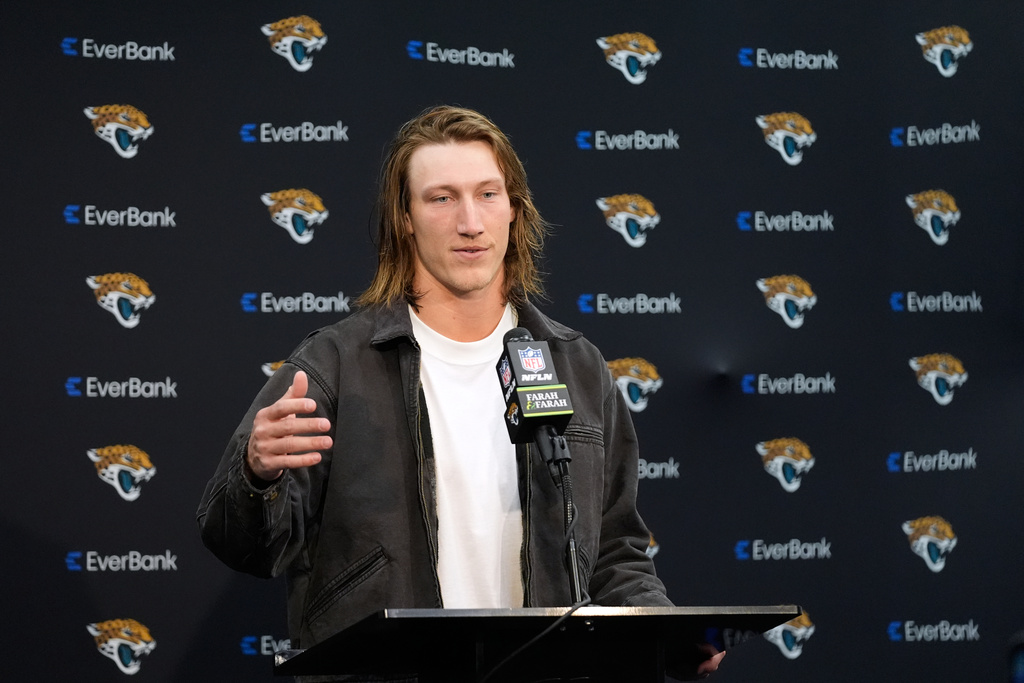Jacksonville Jaguars quarterback Trevor Lawrence talks to reporters following an NFL wild-card playoff football game against the Buffalo Bills Sunday, Jan. 11, 2026, in Jacksonville, Fla. (AP Photo/John Raoux)
