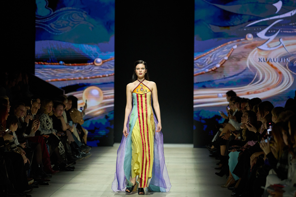 A model wears a creation by Chinese brand Xuaujin on a runway at the Moscow Fashion Week in Moscow, Sunday, March 15, 2026. (AP Photo/Alexander Zemlianichenko)