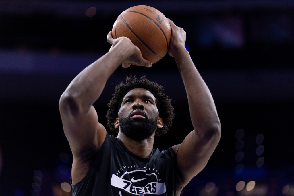 Philadelphia 76ers' Joel Embiid shoots some warm up shots prior to an NBA basketball game against the Atlanta Hawks, Sunday, Nov. 30, 2025, in Philadelphia. (AP Photo/Chris Szagola)